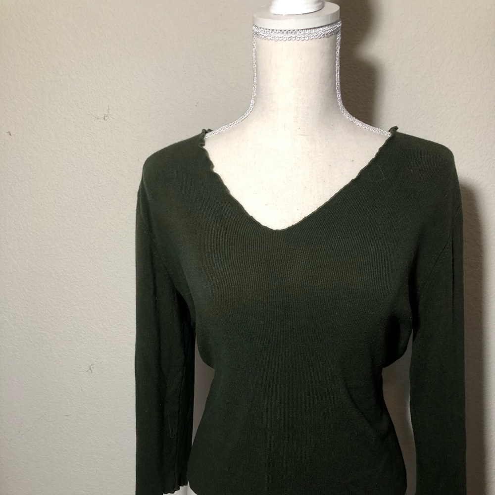 Forest green top with ruffled detail.